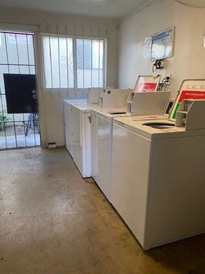 Los Angeles apartment for rent - A white desk with a computer and a monitor on top of it.