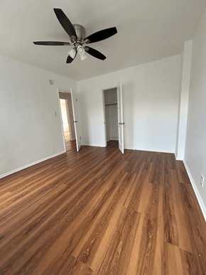 Los Angeles apartment for rent - A room with a ceiling fan and wooden flooring.