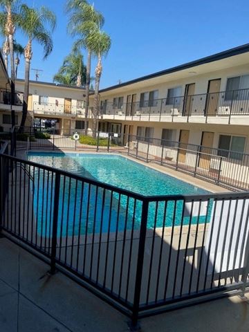 Mission Hills apartment for rent - A pool surrounded by a black fence.