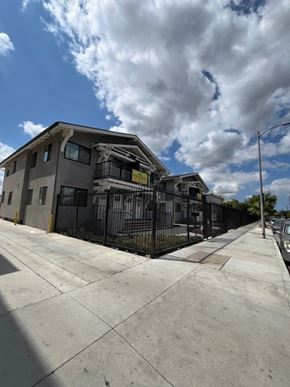 Los Angeles apartment for rent - A modern building with a black fence in front.