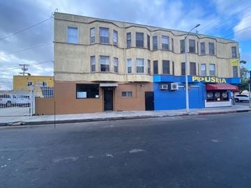 Los Angeles apartment for rent - A building with a blue sign that says "POPUSRIA" on it.