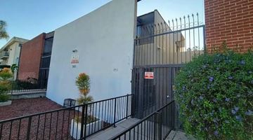 Los Angeles apartment for rent - A white building with a black gate and a sign that says "307".