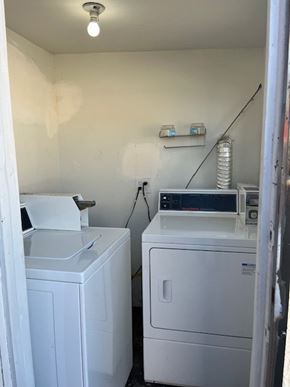 Inglewood apartment for rent - A white washing machine and dryer in a small room.