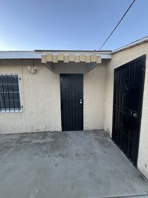 Inglewood apartment for rent - A house with a black door and a black gate.