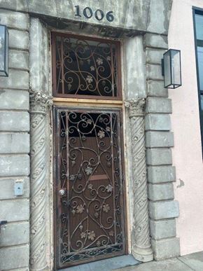 Los Angeles apartment for rent - A wrought iron door with a glass window above it.