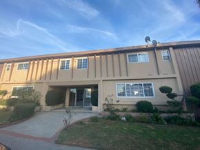 Gardena apartment for rent - A building with a brown facade and a satellite dish on top.