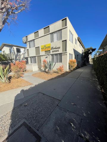 Los Angeles apartment for rent - A building with a sign that says "NO PLASTIC HOUSING" is visible.