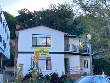 Los Angeles apartment for rent - A white house with a sign that says "No Leasing" and a phone number.