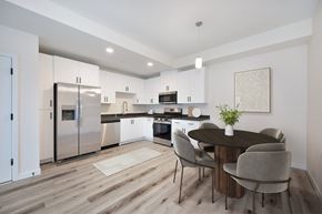 Folsom apartment for rent - A modern kitchen with a dining table set for four.