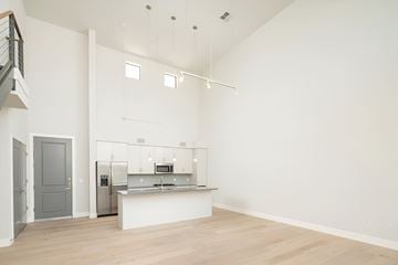 Phoenix apartment for rent - A kitchen with a white counter and a fridge.