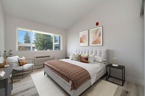 Sacramento apartment for rent - a bedroom with a bed and two windows  at Track 281 Apartments, Sacramento, CA, 95811