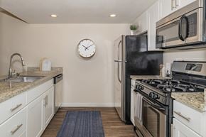 Rocklin apartment for rent - Kitchen with a Black Refrigerator at Rocklin Manor Apartments, California, 95677