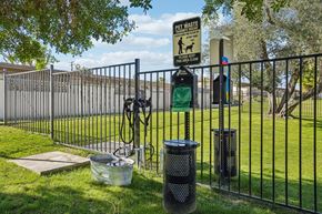 Palm Desert apartment for rent - A sign on a fence reads "PET WASTE PICK UP".