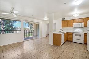 Palm Desert apartment for rent - a kitchen with a stove and a sink and a window