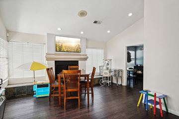 Palm Desert apartment for rent - A living room with a fireplace and a painting above it.