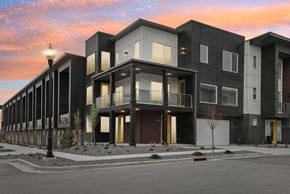 Clearfield townhouse for rent - A modern apartment building with black and white exterior and yellow accents.