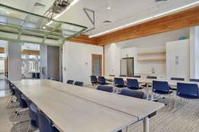 Ogden apartment for rent - A conference room with a long table and chairs.
