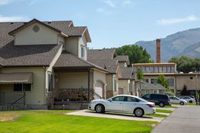 Logan apartment for rent - a row of houses with mountains in the background