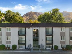 Ogden townhouse for rent - A building with a mountain in the background.