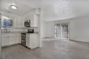 Ogden apartment for rent - A kitchen with white cabinets and a microwave on the counter.
