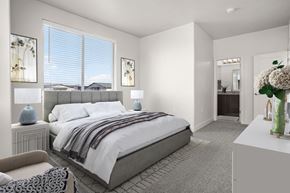 Midvale apartment for rent - A bedroom with a large bed and a chair.