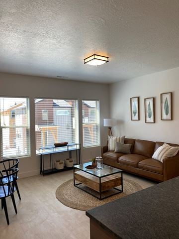 Ogden apartment for rent - a living room with a couch and a coffee table