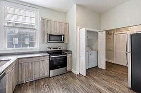 Clearfield apartment for rent - a kitchen with a stove and a refrigerator and a window