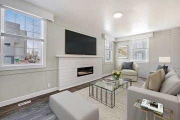 Clearfield apartment for rent - a living room with a fireplace and a television