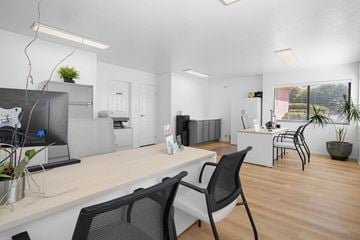 St. George apartment for rent - a living room and kitchen with a desk and chairs