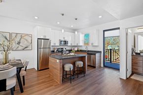 Ogden townhouse for rent - Open kitchen with stainless steel refrigerator at Current by Lotus, Ogden, UT, 84401