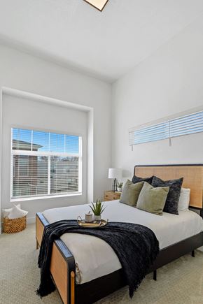 Ogden townhouse for rent - a bedroom with a bed and a window