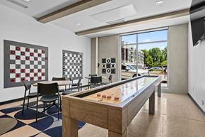 Salt Lake City apartment for rent - A room with a checkerboard patterned floor and a pool table.