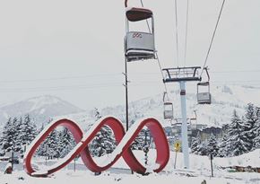 Park City townhouse for rent - A ski lift with a large red infinity symbol in the foreground.