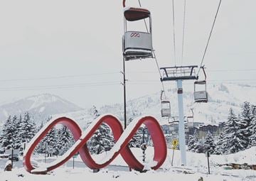 Park City townhouse for rent - A ski lift with a large red infinity symbol in the foreground.