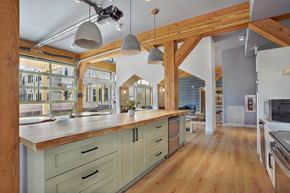 Ogden apartment for rent - A kitchen with wooden cabinets and a large island.