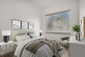 Ogden apartment for rent - A bedroom with a large bed and a window with blinds.