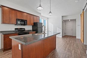 Salt Lake City apartment for rent - a kitchen with wooden cabinets and a counter top