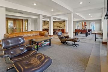 Salt Lake City apartment for rent - A living room with a brown leather chair and a brown leather couch.