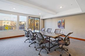 Salt Lake City apartment for rent - a conference room with a wooden table and chairs