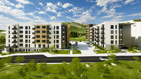 Park City townhouse for rent - A modern apartment complex with a parking lot in front.