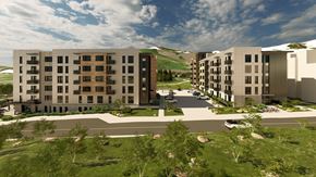 Park City townhouse for rent - A modern apartment complex with a parking lot in front.