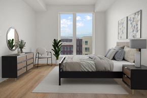 Salt Lake City apartment for rent - a living room with a bed and a window at SPARK Apartments, Salt Lake CIty, UT, 84116