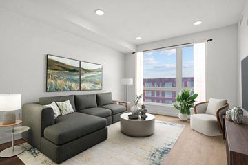 Salt Lake City apartment for rent - a living room with gray furniture and a large window