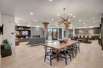 Lewisville apartment for rent - A modern living room with a wooden table and chairs.