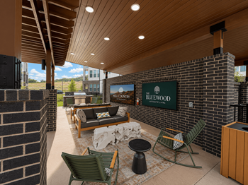 Outdoor lounge with shaded seating & grilling stations