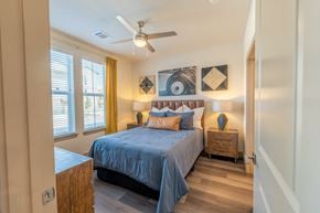 Celina apartment for rent - Luxury apartment bedroom with large windows and ceiling fan at One Preston Station Apartments.
