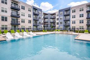 Little Elm apartment for rent - Resort-style swimming pool with lounge seating at The District