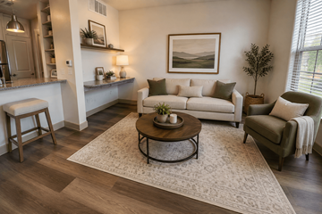 Celina apartment for rent - A living room with a white couch, a coffee table, and a painting on the wall.