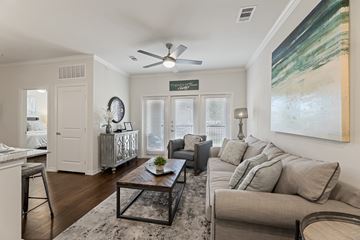 Burleson apartment for rent - A living room with a couch, a coffee table, and a painting on the wall.