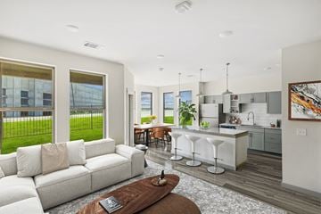 Midlothian apartment for rent - A modern living room with a white sofa and a coffee table.